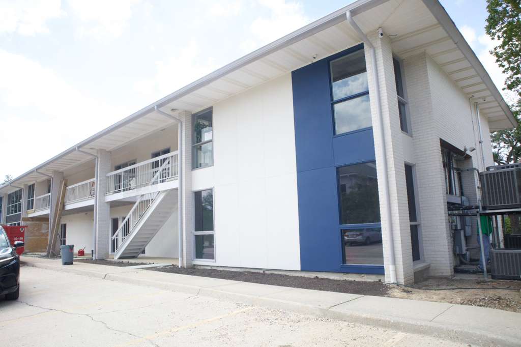 Modern Louisiana commercial office building with bronze-tinted solar control window film