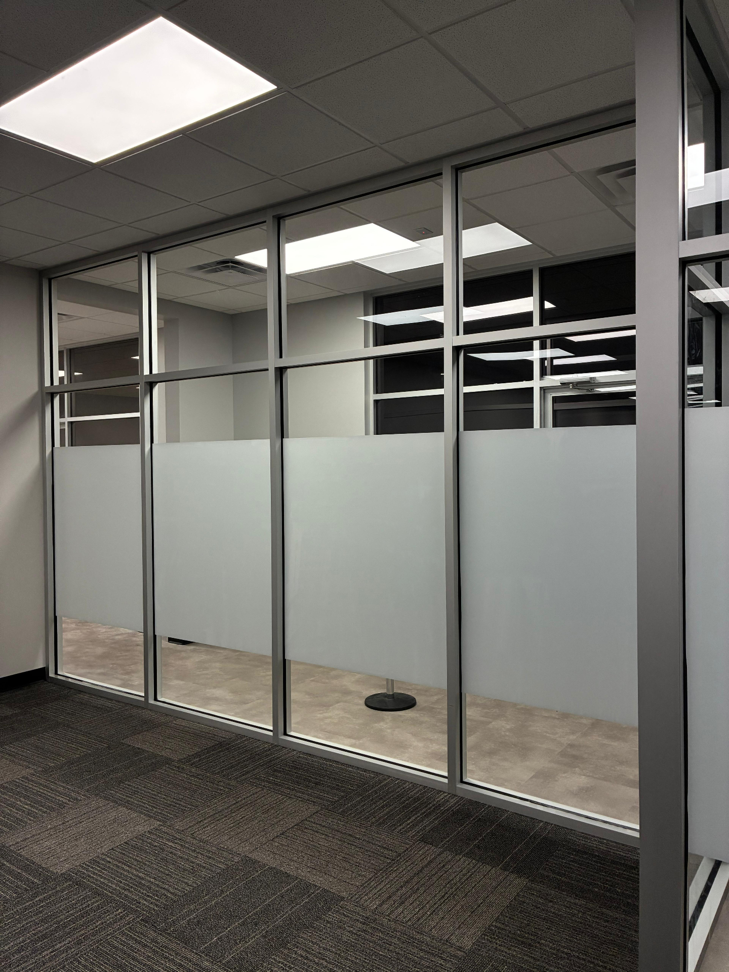 LCRT installer applying architectural window film to commercial glass
