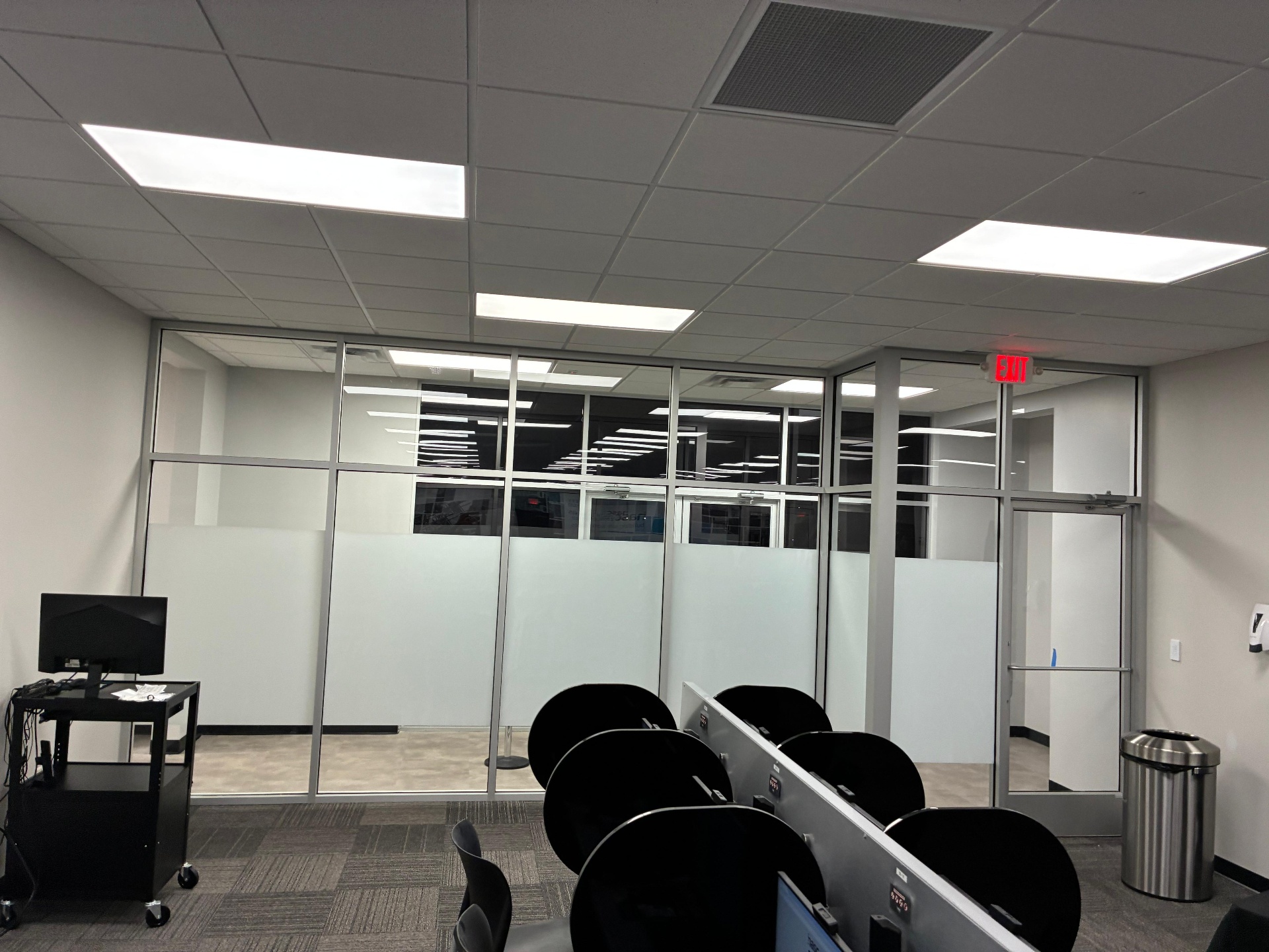 Modern conference room with frosted decorative privacy film on glass partitions